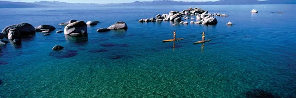 Lake Tahoe: Two women paddle boarding in a lake 2, Lake Tahoe, California, USA by Panoramic Images