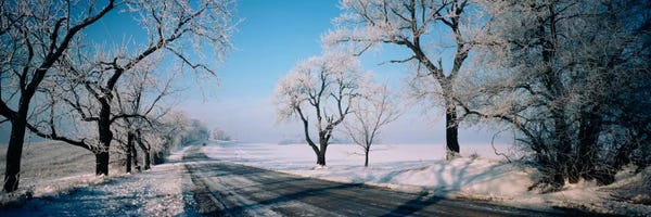 Road passing through winter fieldsIllinois, USA