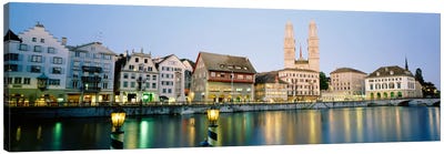 Riverfront Architecture At Twilight Featuring Grossmunster, Limmat River, Zurich, Switzerland Canvas Art Print - Zurich Art