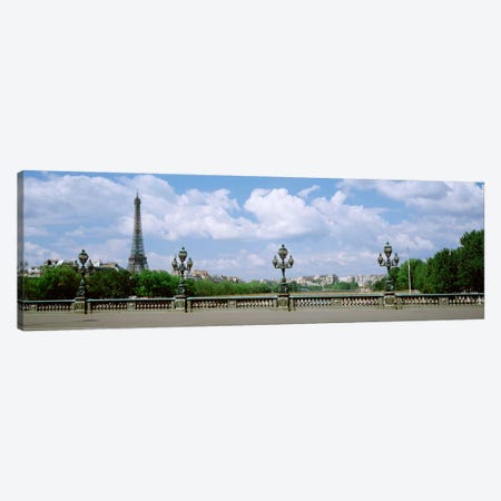 Cloudy View Of The Eiffel Tower As Seen From Pont Alexandre III, Paris, Ile-de-France, France Canvas Print #PIM1327} by Panoramic Images Canvas Art Print