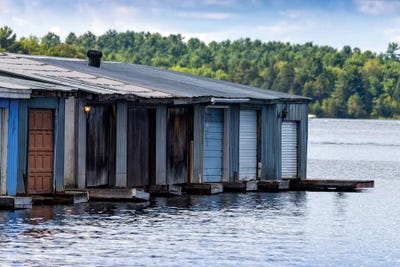 Row Of Old Boathouses, Lake Muskoka, Ontario, Canada by Panoramic Images framed wall art