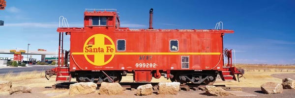 Trains: Red Atchison-Topeka-Santa Fe Railway (ATSF) Caboose, Visitors Center Display, Winslow, Navajo County, Arizona, USA by Panoramic Images