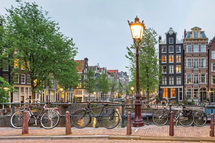 Bikes And Houses Along Canal At Dusk, Amsterdam, North Holland