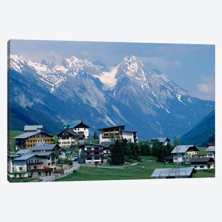 High angle view of a village on a landscape and a mountain range in the background, St. Anton, Austria Canvas Print #PIM1445} by Panoramic Images Canvas Artwork