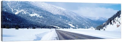 Road Passing Through A Snow Covered Landscape, Yellowstone National Park, Wyoming, USA Canvas Art Print - Snowy Mountain Art