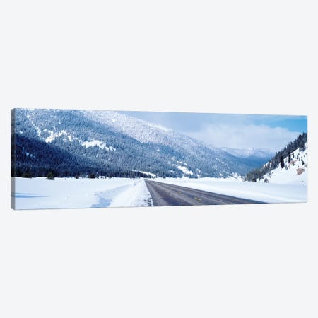 Road Passing Through A Snow Covered Landscape, Yellowstone National Park, Wyoming, USA Canvas Print #PIM14844} by Panoramic Images Canvas Art