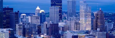 Buildings in a city lit up at dusk, Pittsburgh, Pennsylvania, USA by Panoramic Images framed canvas print