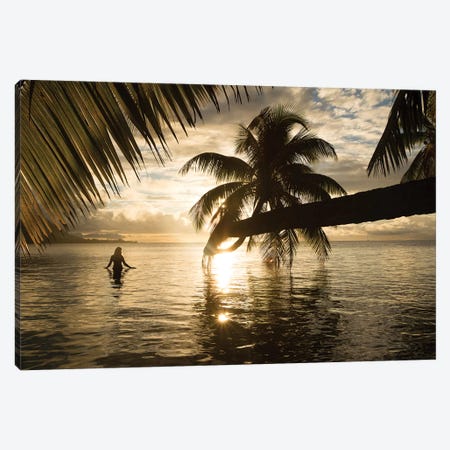Woman Standing In The Pacific Ocean At Sunset, Moorea, Tahiti, French Polynesia I Canvas Print #PIM15068} by Panoramic Images Canvas Artwork