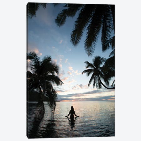 Woman Standing In The Pacific Ocean At Sunset, Moorea, Tahiti, French Polynesia II Canvas Print #PIM15069} by Panoramic Images Canvas Wall Art