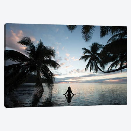 Woman Standing In The Pacific Ocean At Sunset, Moorea, Tahiti, French Polynesia III Canvas Print #PIM15070} by Panoramic Images Canvas Art Print