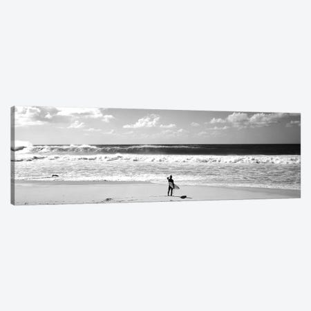 Surfer Standing On The Beach, North Shore, Oahu, Hawaii, USA Canvas Print #PIM15243} by Panoramic Images Canvas Artwork