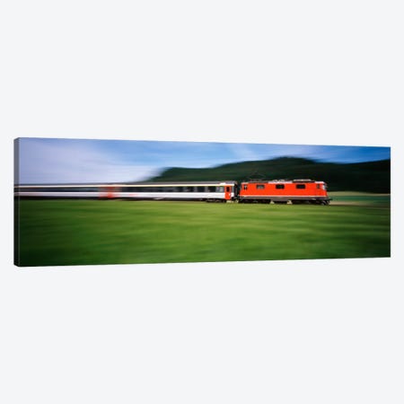 Train moving on a railroad track Canvas Print #PIM1535} by Panoramic Images Canvas Art