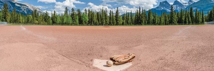 Baseball glove and ball on landscape, Baseball Diamond, Alberta, Canada