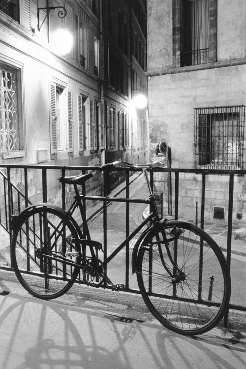 Bicycle against railing, Paris, France