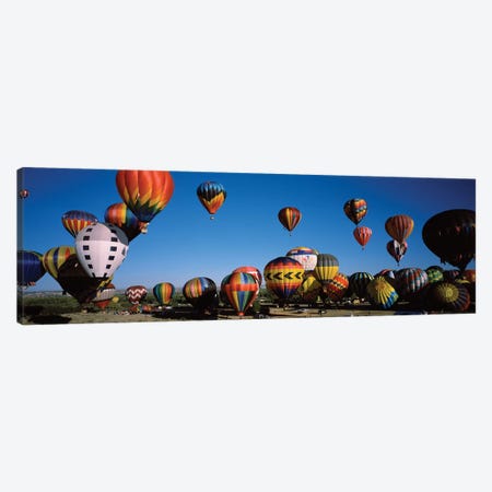Hot air balloons floating in sky, Albuquerque International Balloon Fiesta, Albuquerque, Bernalillo County, New Mexico, USA Canvas Print #PIM15517} by Panoramic Images Art Print