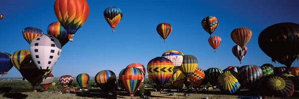 New Mexico: Hot air balloons floating in sky, Albuquerque International Balloon Fiesta, Albuquerque, Bernalillo County, New Mexico, USA by Panoramic Images