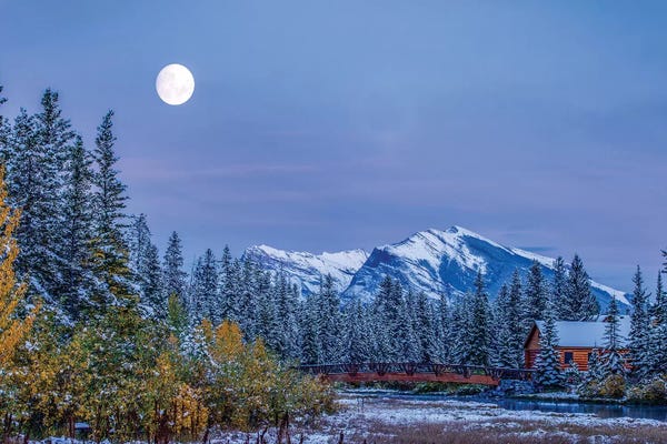 Alberta: Moon over Pigeon Mountain and log cabin in forest and bridge near Policemans Creek, Canmore, Alberta, Canada by Panoramic Images