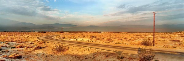 Palm Springs: Road passing through desert, Palm Springs, Riverside County, California, USA by Panoramic Images