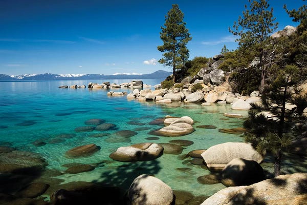 Nevada: Rocks in a lake with mountain range in the background, Lake Tahoe, California, USA by Panoramic Images