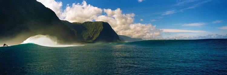 Rolling waves with mountains in the background, Molokai, Hawaii