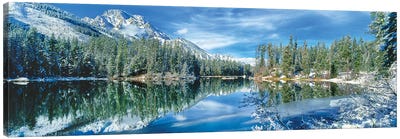 Snow covered mountain and trees reflected in lake, Grand Tetons, Wyoming, USA Canvas Art Print - Wyoming Art