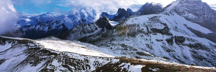 Snow covered mountain range against cloudy sky, Bugaboo Provincial Park, British Columbia, Canada