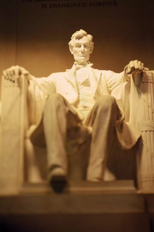 Statue of Abraham Lincoln illuminated at night, Lincoln Memorial, Washington DC, USA