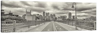 Stone Arch Bridge with buildings in the background, Mill District, Upper Midwest, Minneapolis, Hennepin County, Minnesota, USA Canvas Art Print - Panoramic Cityscapes