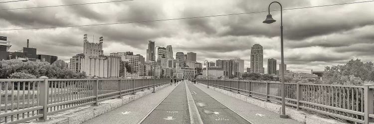 Stone Arch Bridge with buildings in the background, Mill District, Upper Midwest, Minneapolis, Hennepin County, Minnesota, USA by Panoramic Images wall art