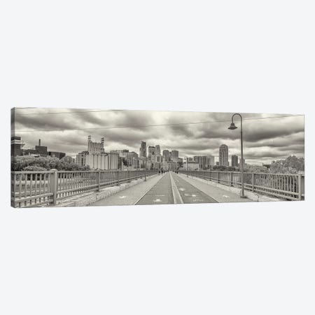 Stone Arch Bridge with buildings in the background, Mill District, Upper Midwest, Minneapolis, Hennepin County, Minnesota, USA Canvas Print #PIM15763} by Panoramic Images Canvas Art Print