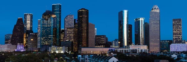 City Sunrises & Sunsets: High Rise Buildings In Houston Cityscape Illuminated At Sunset, Houston, Texas by Panoramic Images