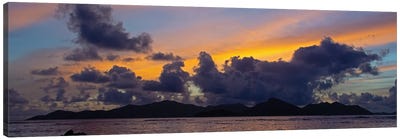 Silhouetted Fishing Boat In Sea At Sunset With Praslin Island In Background, La Digue, Seychelles Canvas Art Print - La Digue
