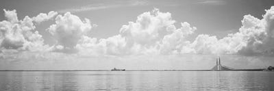 Sea With A Container Ship And A Suspension Bridge In distant, Sunshine Skyway Bridge, Tampa Bay, Gulf of Mexico, Florida, USA by Panoramic Images canvas print