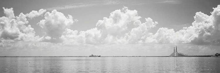 Sea With A Container Ship And A Suspension Bridge In distant, Sunshine Skyway Bridge, Tampa Bay, Gulf of Mexico, Florida, USA