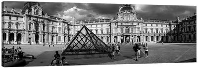 Tourists Near A Glass Pyramid At Musee Du Louvre, Paris, France Canvas Art Print - Pyramid Art