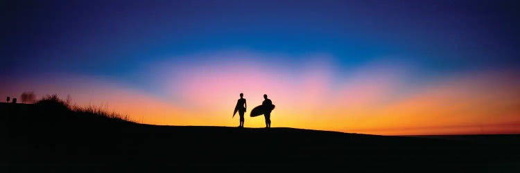 Silhouettes Of Two Surfers On Beach At Sunset, Palos Verde, California, USA