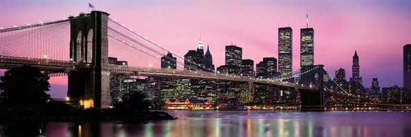 Canvas Print: Bridge Across A River Lit Up At Dusk, Manhattan, New York City, New York State, USA by Panoramic Images