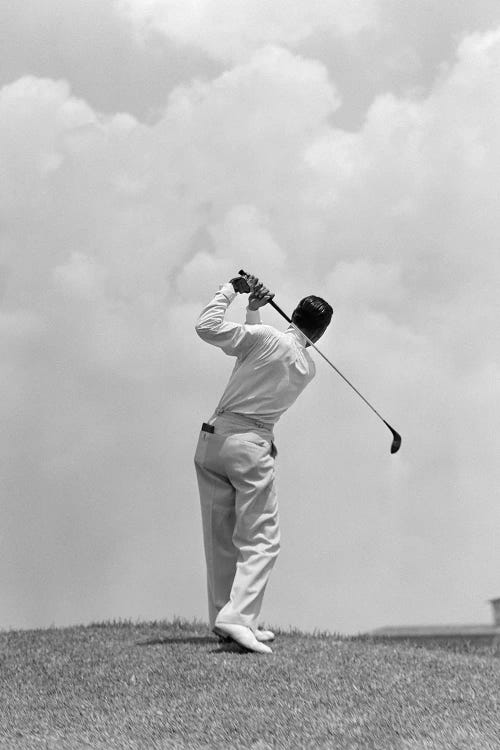 Man Playing Golf Teeing-Off Golf Ball From Tee With Driver Outdoor