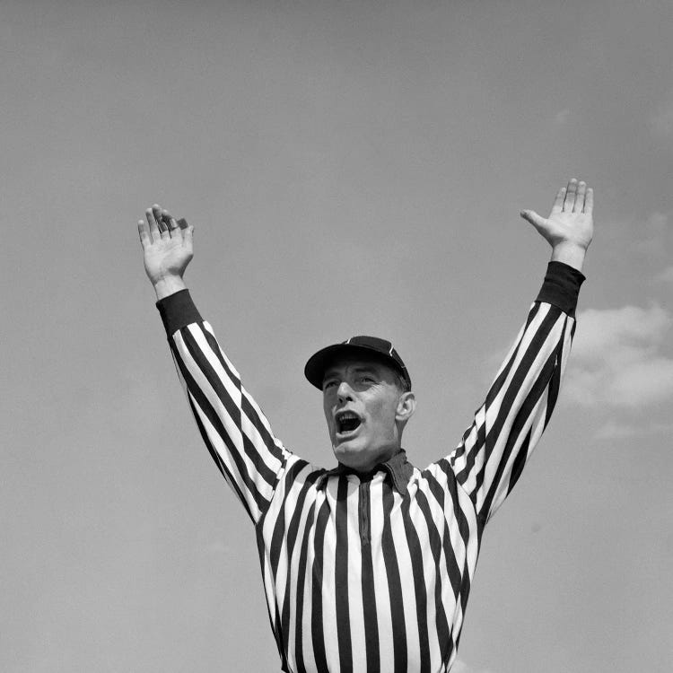1950s Football Referee Making Touchdown Signal
