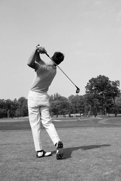 1970s Man Swing Golf Club by Panoramic Images framed canvas print