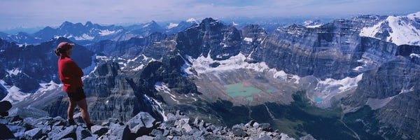 Side Profile Of A Woman Standing On A Mountain Top, Mt Temple, Banff National Park, Alberta, Canada