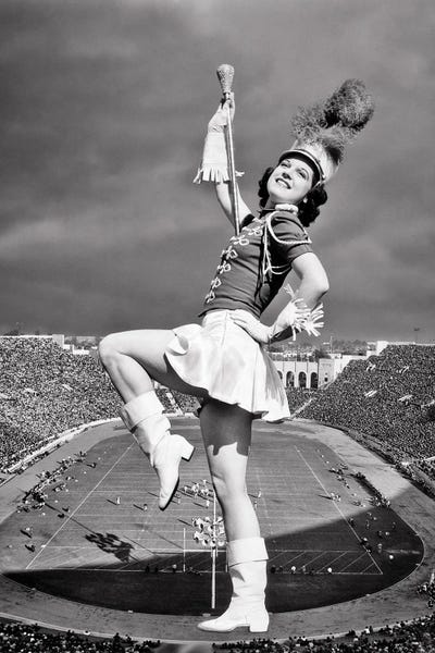 1940s Marching Band Drum Majorette Super Imposed On Aerial Shot Of Football Stadium