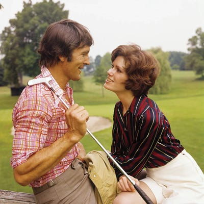 Panoramic Images - Framed Fine Art Prints: 1970s Romantic Couple Man Woman At Golf Course by Panoramic Images