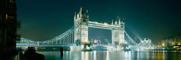Tower Bridge: Low angle view of a bridge lit up at nightTower Bridge, London, England by Panoramic Images