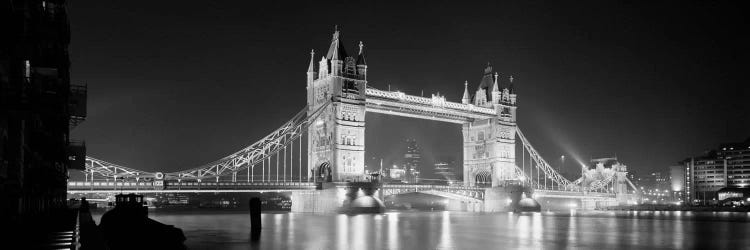 Low angle view of a bridge lit up at night, Tower Bridge, London, England (black & white)