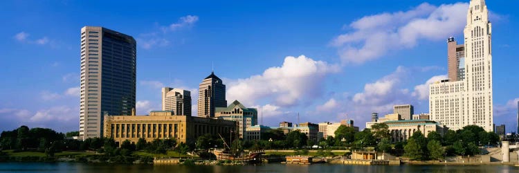 Buildings on the banks of a riverScioto River, Columbus, Ohio, USA