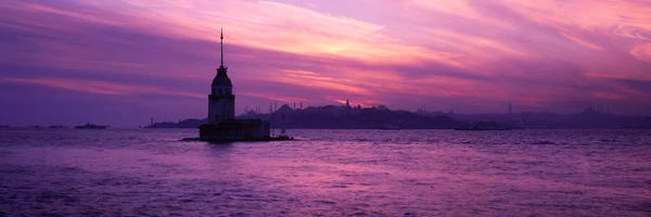 Blue Mosque: Lighthouse in the sea with mosque in the background, St. Sophia, Leander's Tower, Blue Mosque, Istanbul, Turkey by Panoramic Images