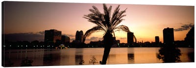 Silhouette of buildings at the waterfront, Lake Eola, Summerlin Park, Orlando, Orange County, Florida, USA Canvas Art Print - Orlando Art