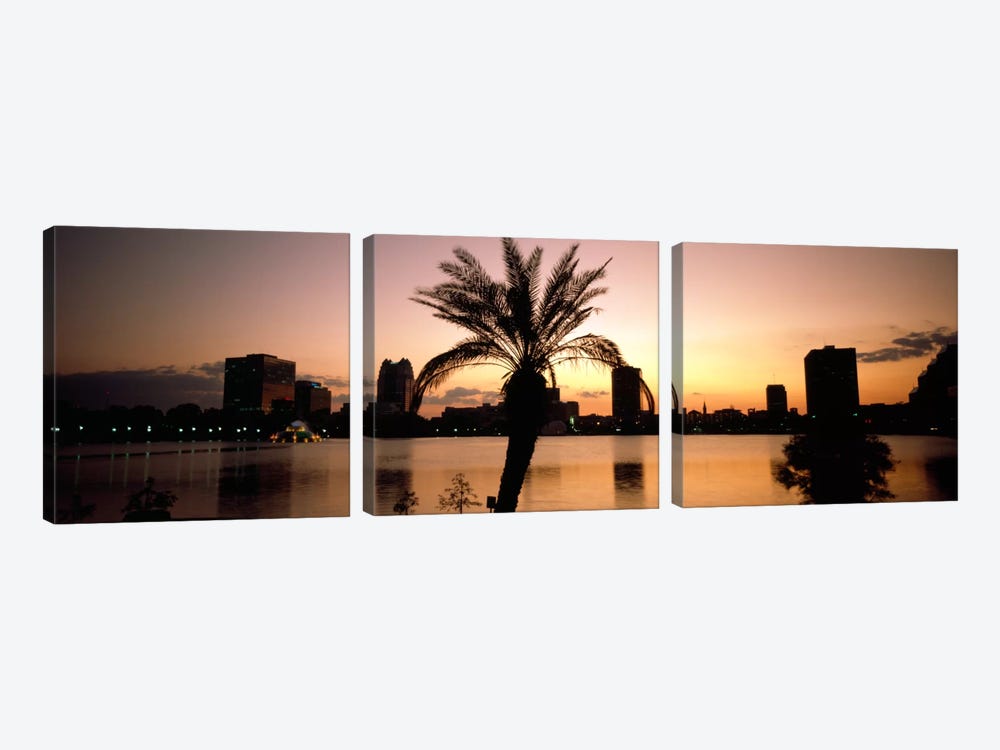 Silhouette of buildings at the waterfront, Lake Eola, Summerlin Park, Orlando, Orange County, Florida, USA by Panoramic Images 3-piece Art Print