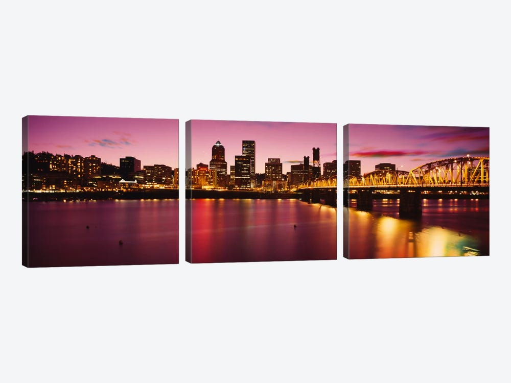 Skyscrapers lit up at sunset, Willamette River, Portland, Oregon, USA by Panoramic Images 3-piece Canvas Print